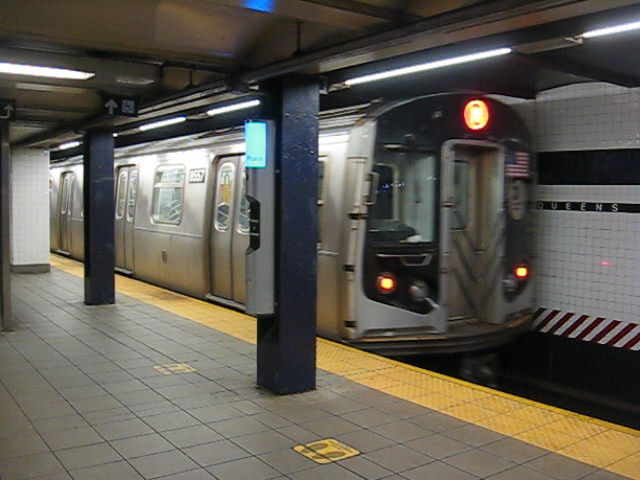 Blurry picture of the front of a New York City subway train.